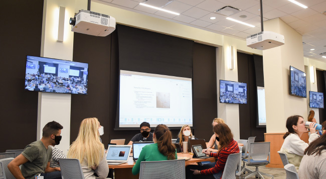 NEC Large Screen displays and projectors being used in a large media room